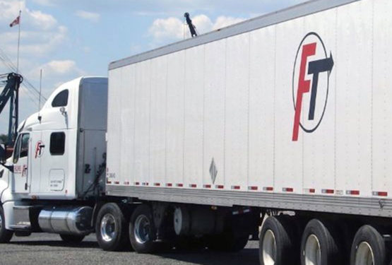Transport truck on road with Fluke logo on side