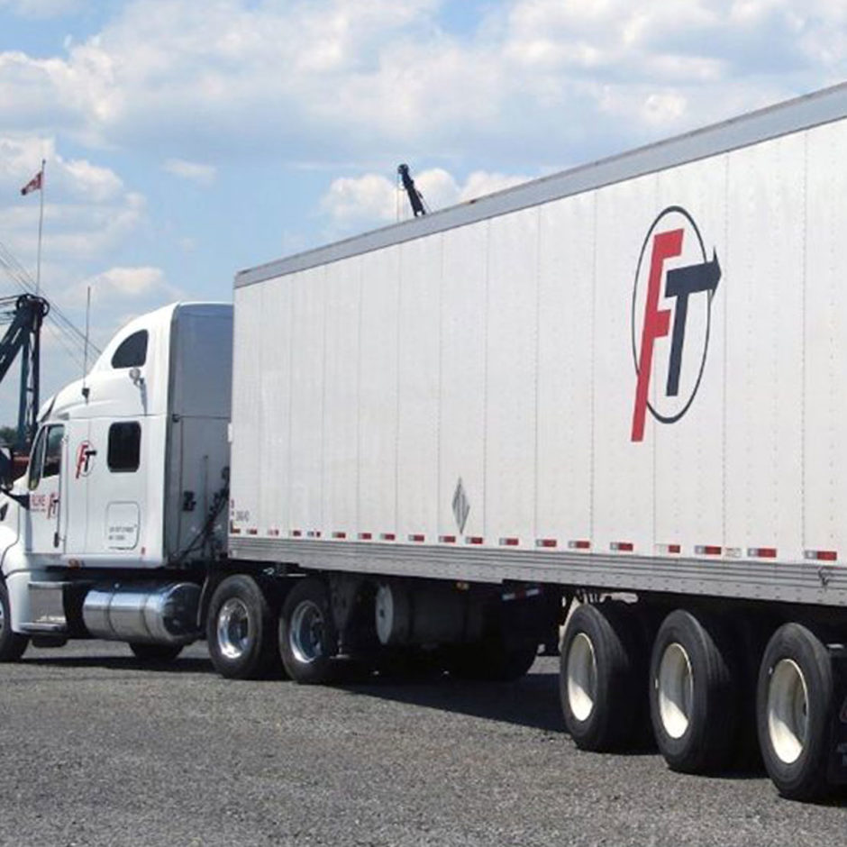 Transport truck on road with Fluke logo on side
