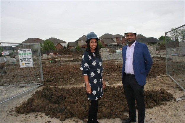 Anita Dharamshi and Anupam Kothari in front of the site on Upper James where the $20 million TownePlace Suites by Marriott is being built. - Mark Newman , Hamilton Mountain News 