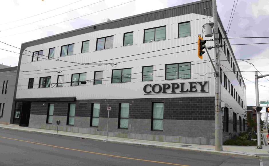 Exterior view of white Coppley Building