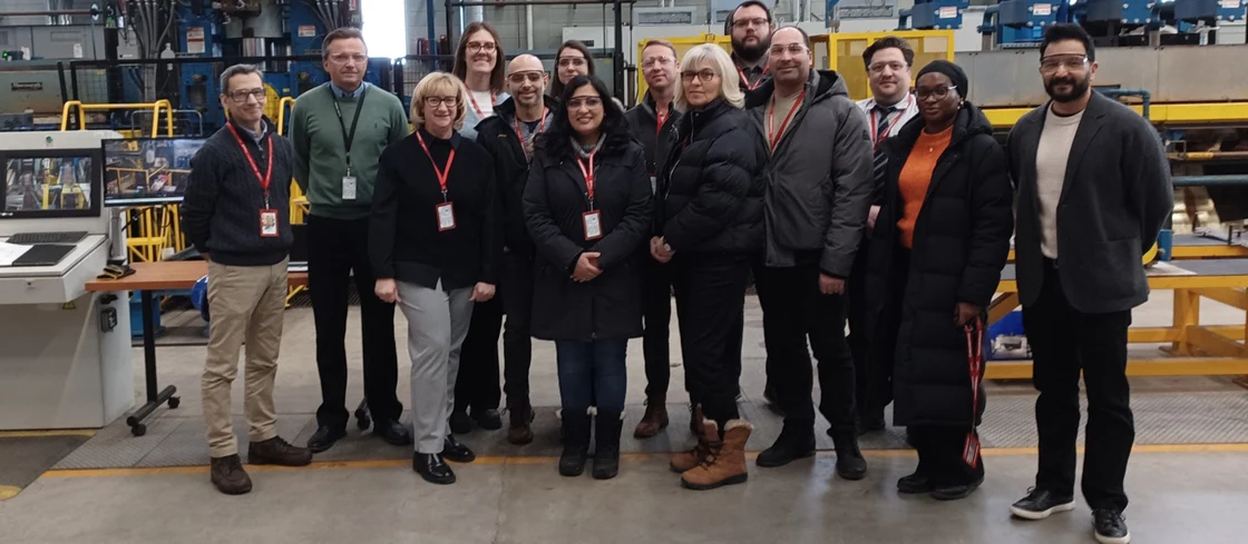 A group of people attending a factory tour