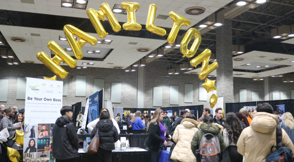 The word Hamilton is displayed using balloons above booths at the Connect to Career Job Fair in Hamilton, Ontario