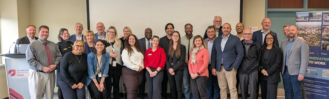 Members of the City of Hamilton and City of Laval pose together for a photo at McMaster Innovation Park in Hamilton.