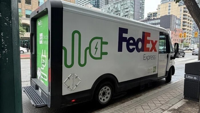 An electric-powered FedEx Express delivery vehicle parked outside