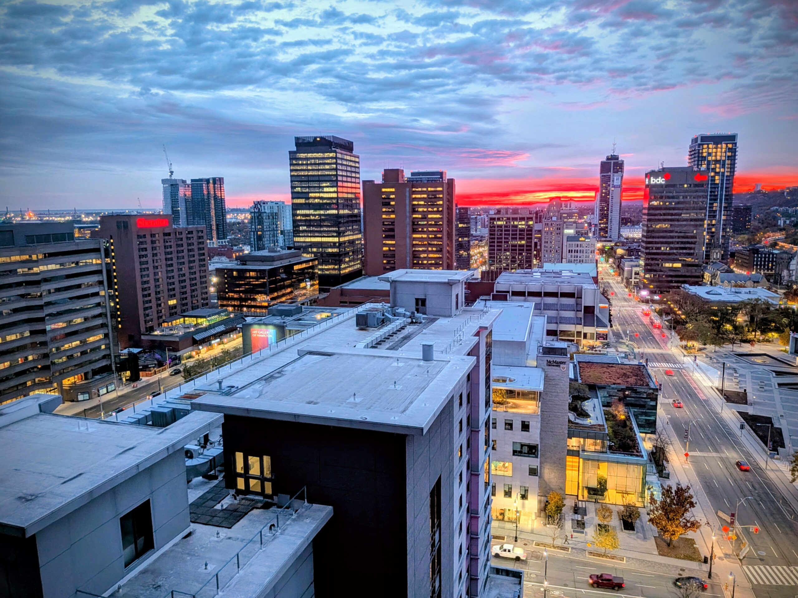 The sun rises in downtown hamilton with an overhead photo showing the downtown core