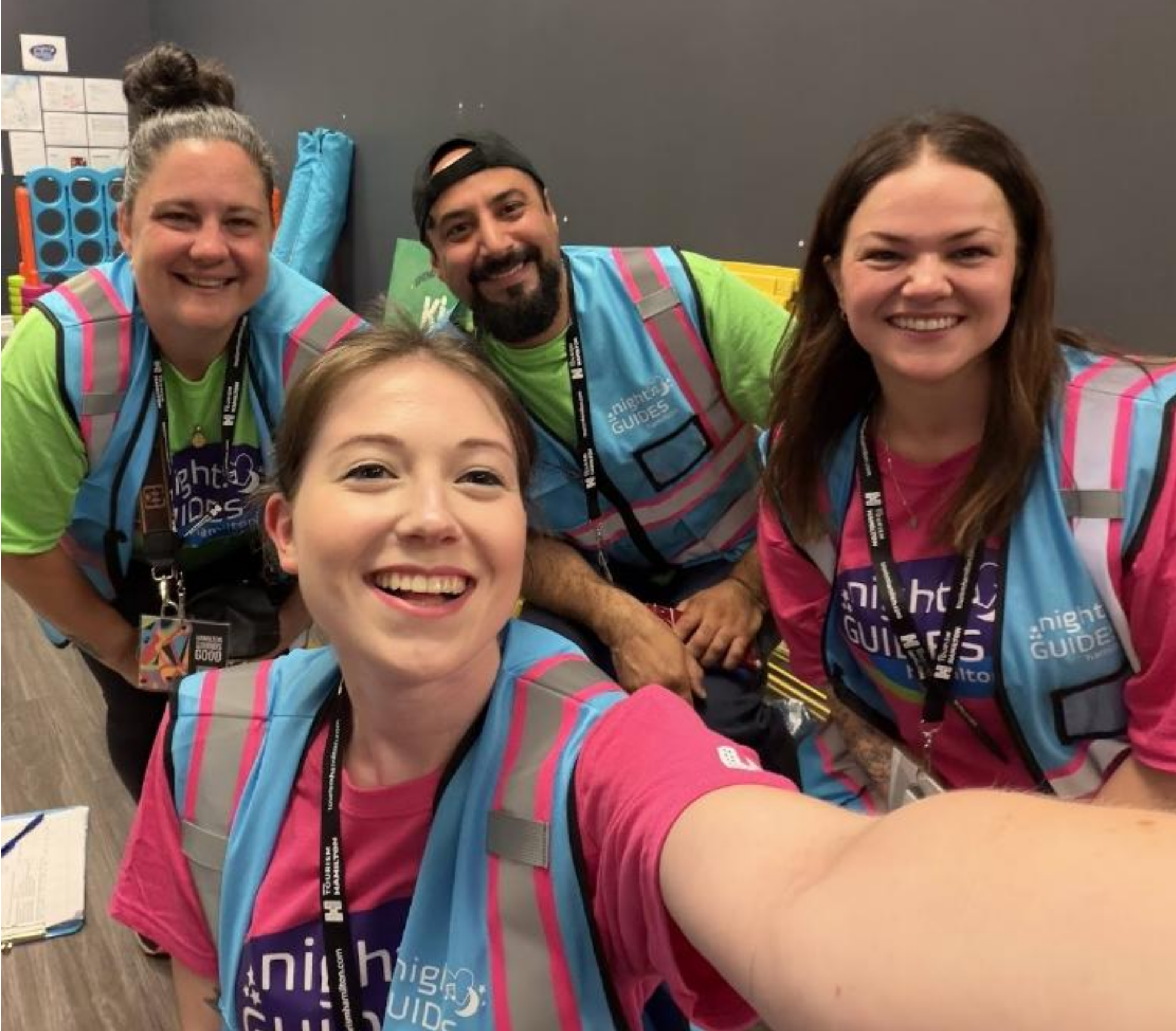 A group of four Hamilton Night Guides take a selfie in full uniform